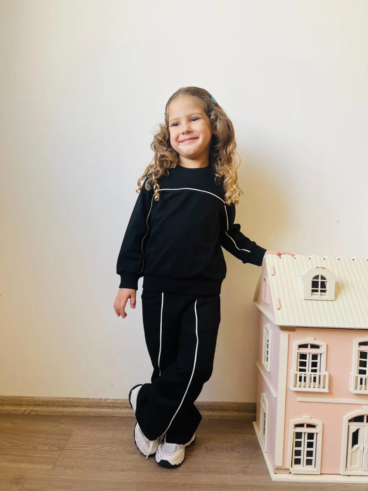 Black childrenswear tracksuit with contrast piping