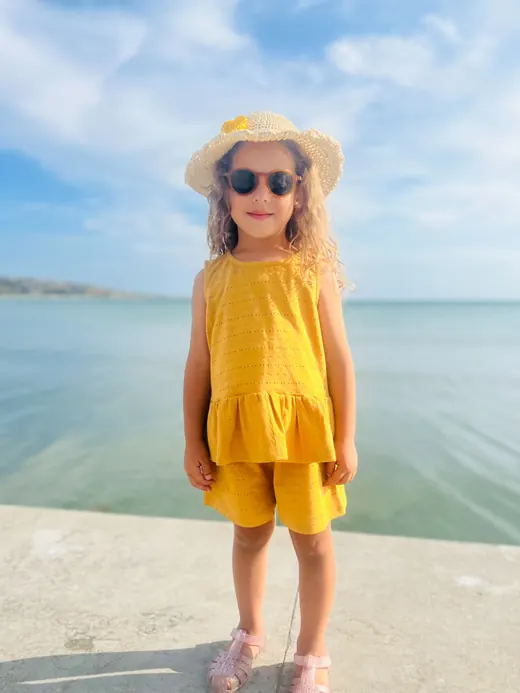 Yellow sleeveless childrenswear top and shorts set