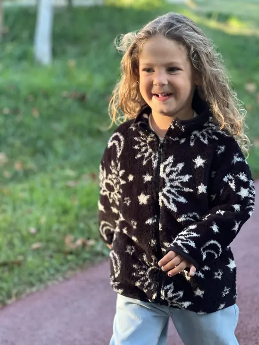 Black snow-print childrenswear fleece top