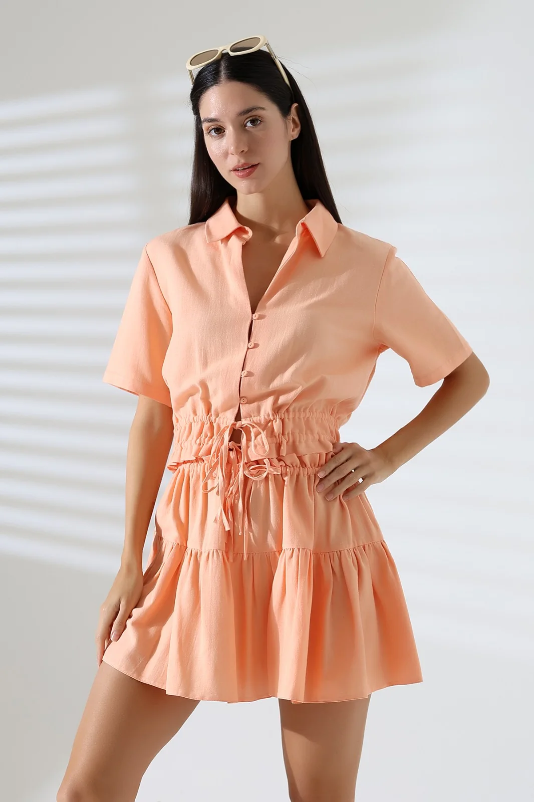 Peach satin womenswear shirt and shorts set