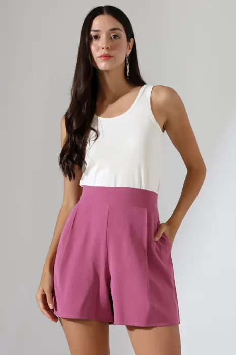 White sleeveless top with pink womenswear shorts