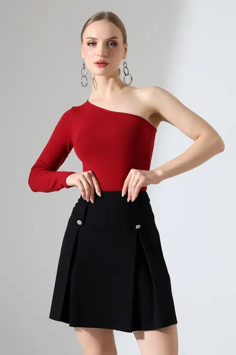 Red asymmetric womenswear top with black skirt