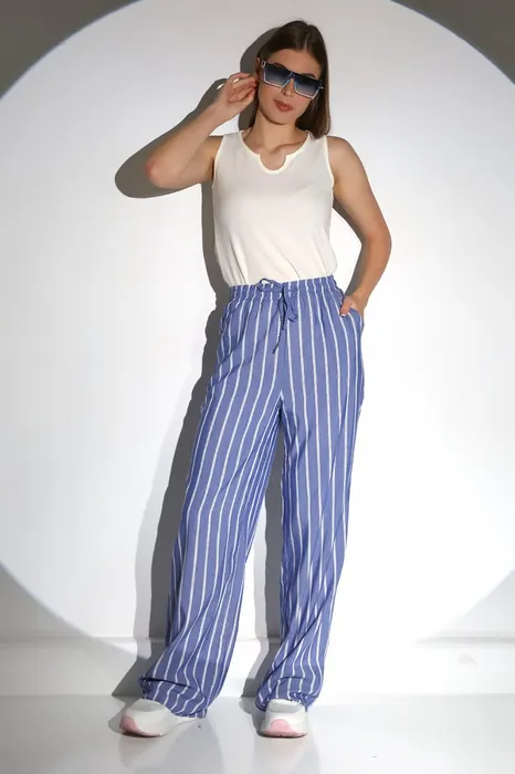 White womenswear top with blue striped trousers