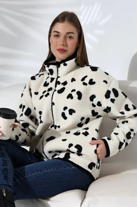 White womenswear fleece jacket with black spots